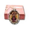 Dije encapsulado de la virgencita doble vista